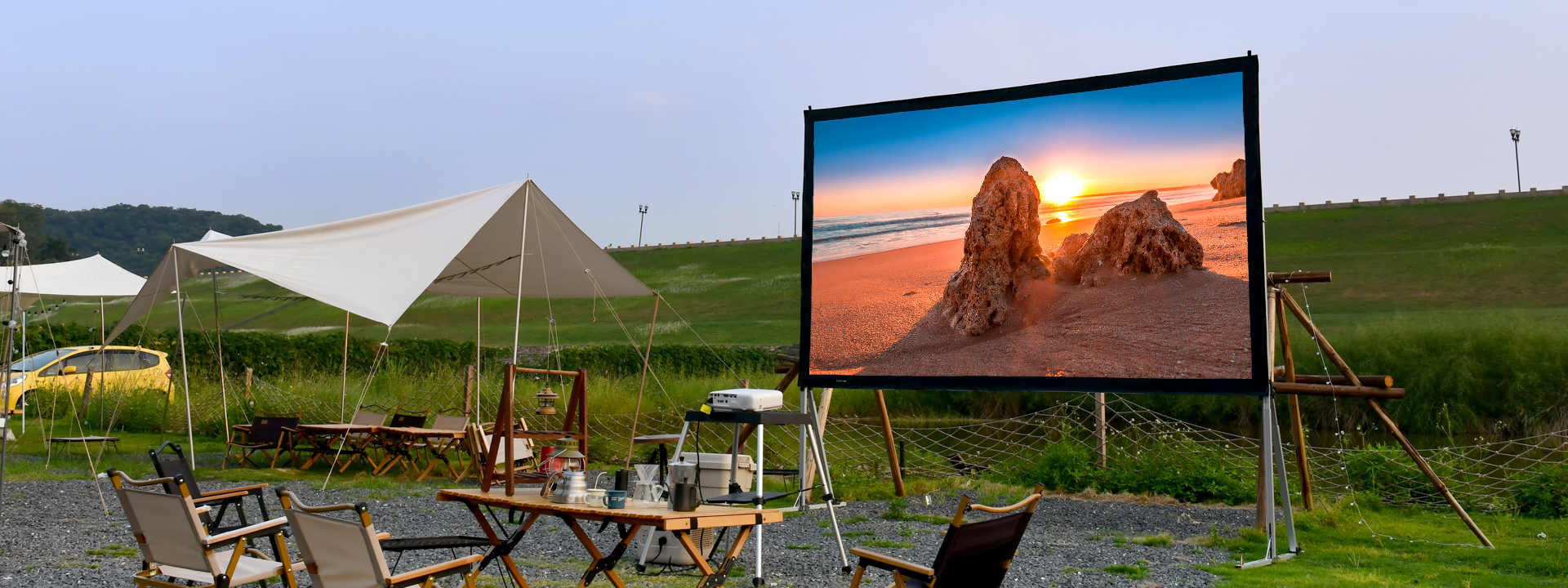 Portable screenpro screen with projector display in a park.