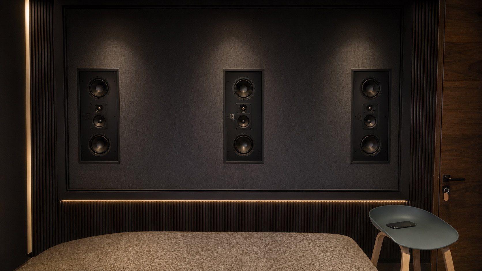 Front speakers installed behind SCREENPRO acoustic transparent home theater screen
