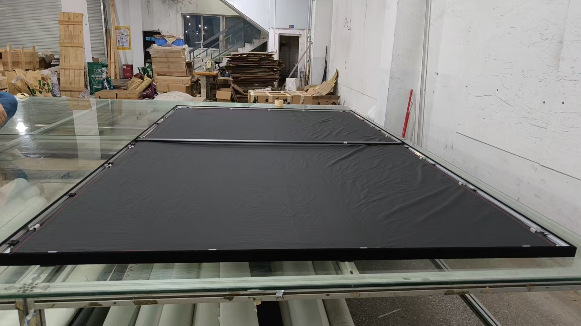black acoustically transparent backing behind woven projection screen